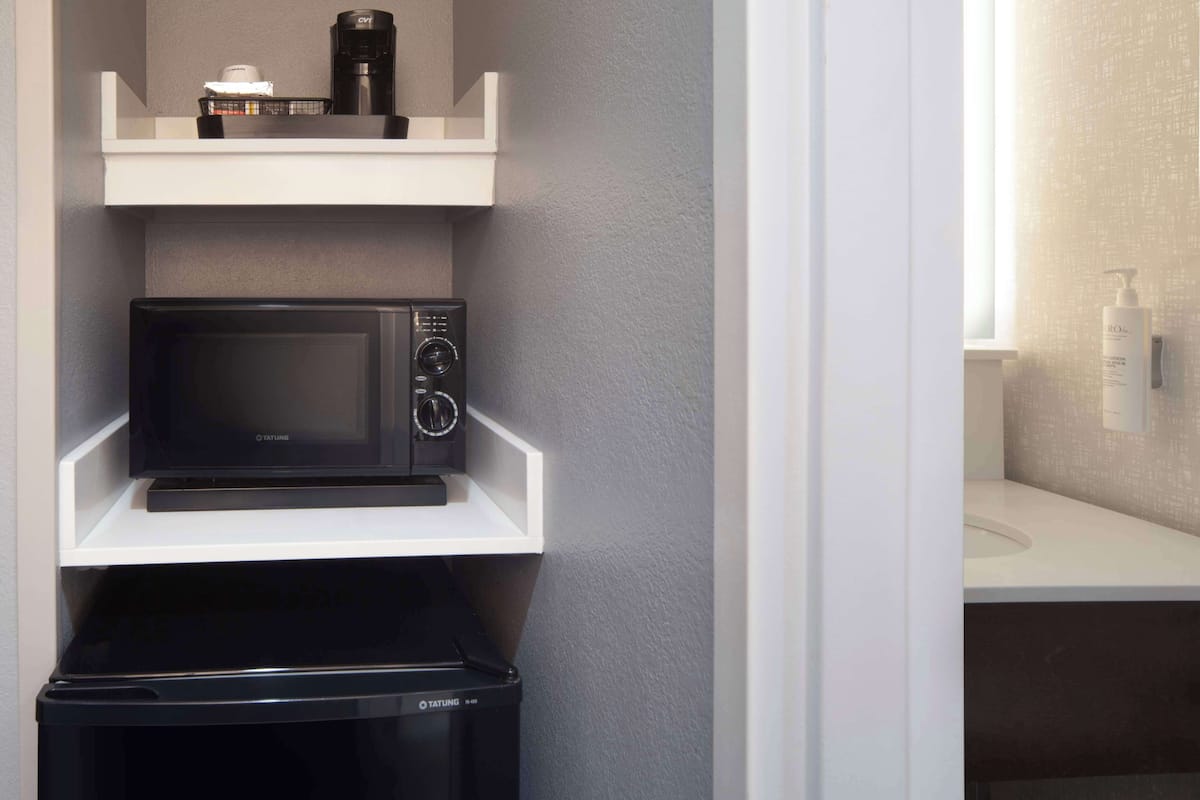 desk, laptop workspace, blackout curtains, iron/ironing board