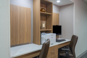 A modern office space with a desk, computer, and office chair. - Hampton Inn Marietta (Marietta)