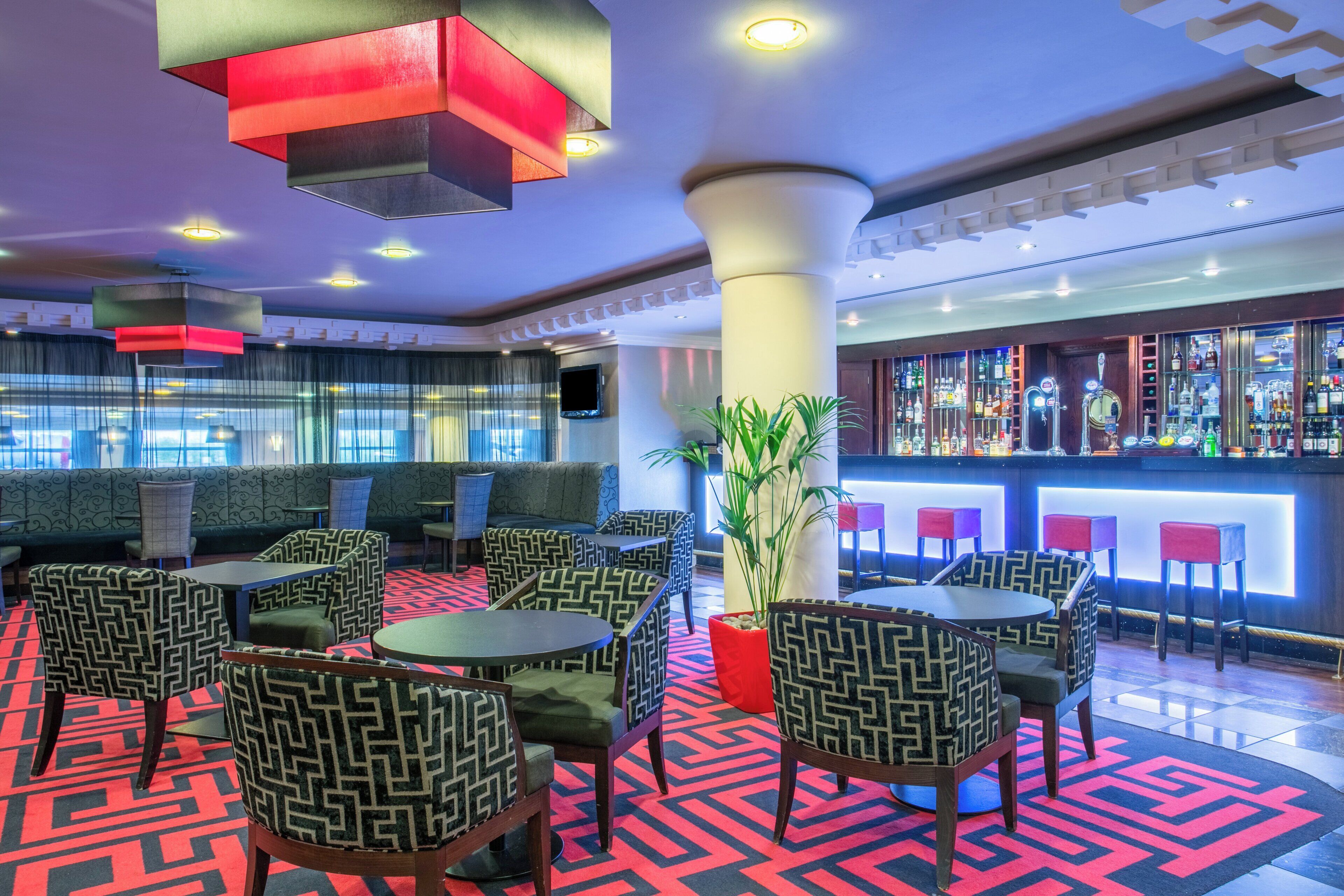A bar area with seating and a bar counter.
