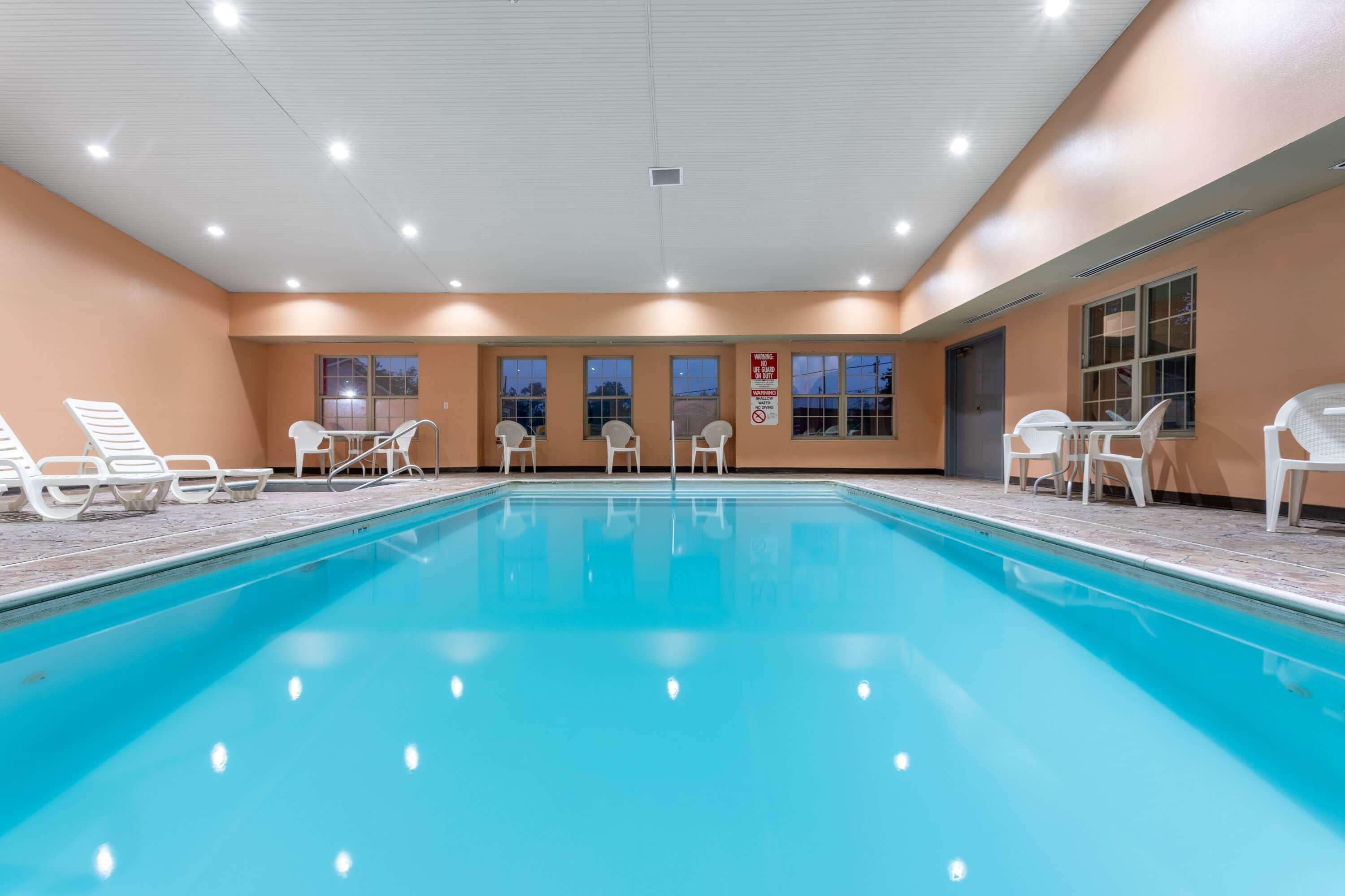 Indoor pool, open 9:00 AM to 10:00 PM, pool loungers