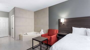 Suite estudio Deluxe, 1 cama King size, para no fumadores | Camas con pillow-top, caja de seguridad en la habitación y escritorio