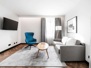 Junior Suite, 1 King Bed with Sofa bed | In-room safe, desk, laptop workspace, blackout drapes