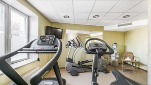 A gym with treadmills, elliptical machines, and a water dispenser. - Mercure Klaipeda City (Klaipeda)