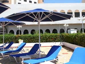 Outdoor pool, pool umbrellas, sun loungers