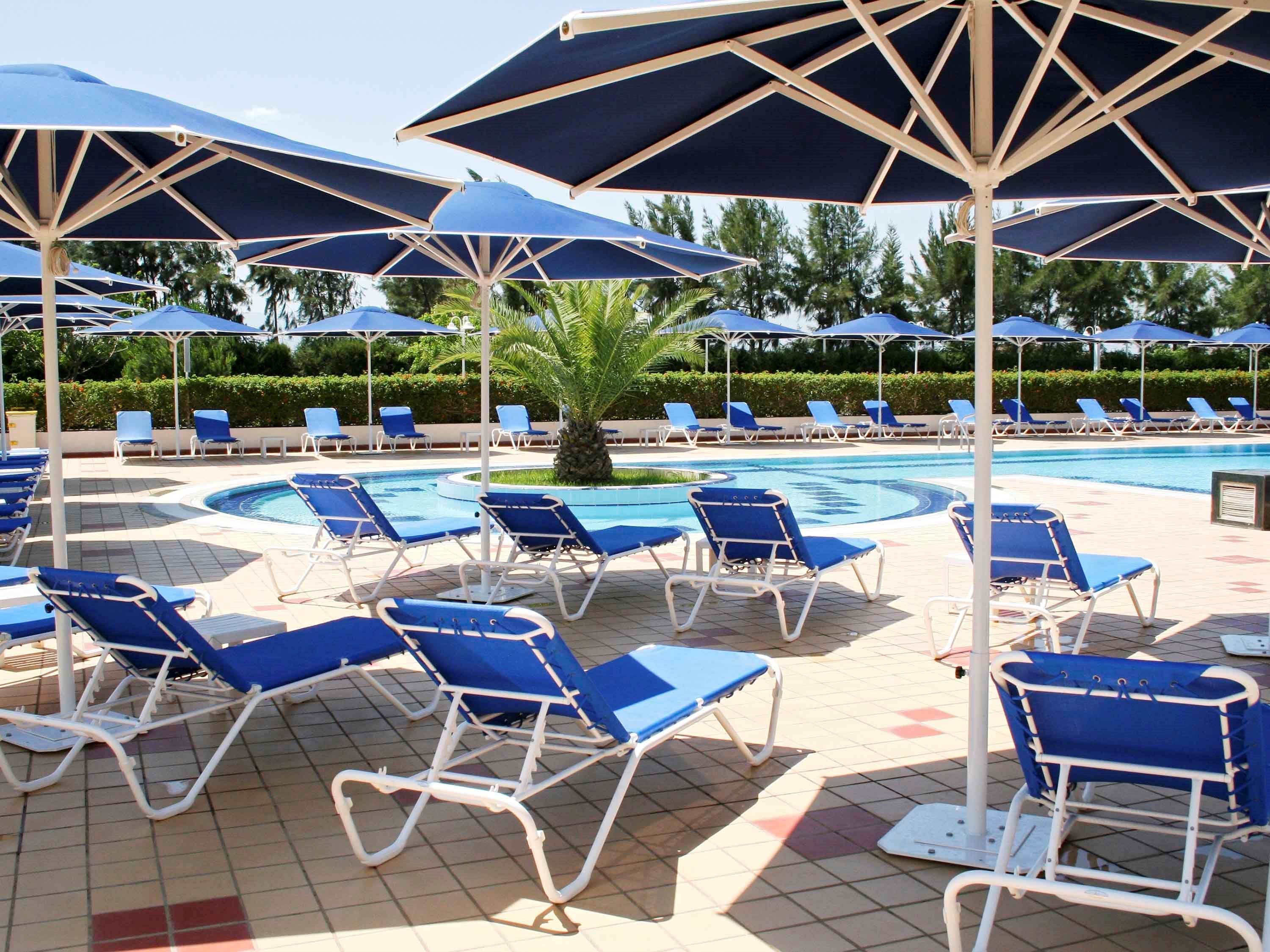 outdoor pool, pool umbrellas, pool loungers