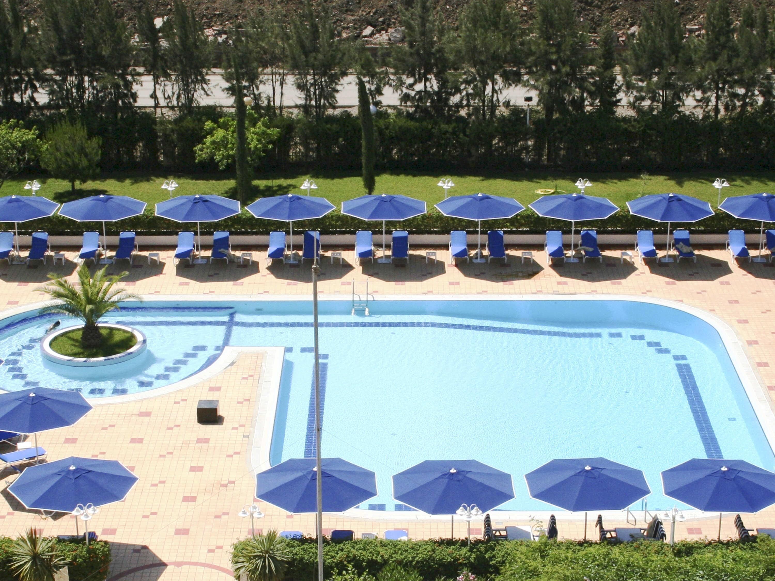 outdoor pool, pool umbrellas, pool loungers