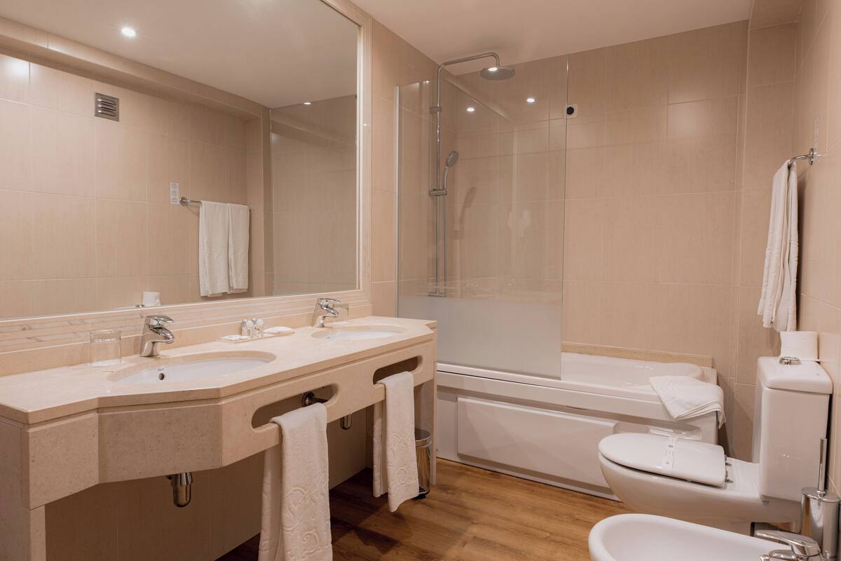 deep-soaking bathtub, rainfall showerhead, free toiletries, hair dryer