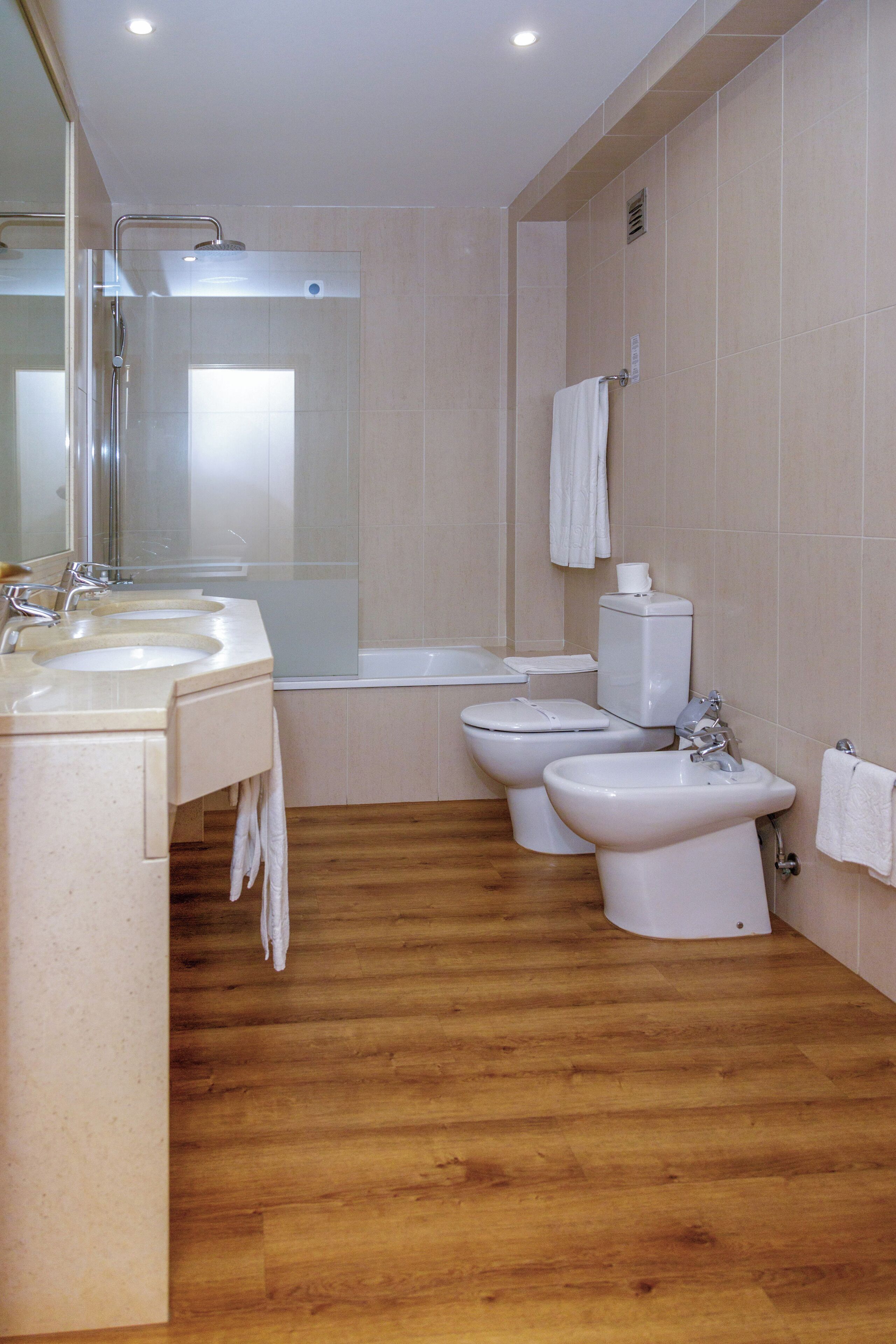 family room | bathroom | deep-soaking bathtub, rainfall showerhead, free toiletries, hair dryer