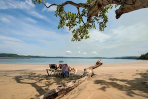On the beach, sun loungers, beach towels