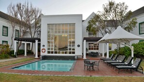 Outdoor pool, pool umbrellas, sun loungers