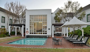 Outdoor pool, pool umbrellas, sun loungers