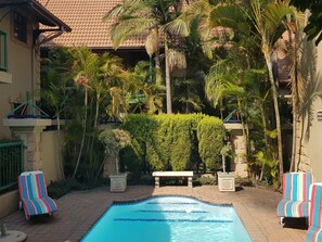 Outdoor pool, pool umbrellas, sun loungers