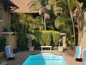 Outdoor pool, pool umbrellas, sun loungers