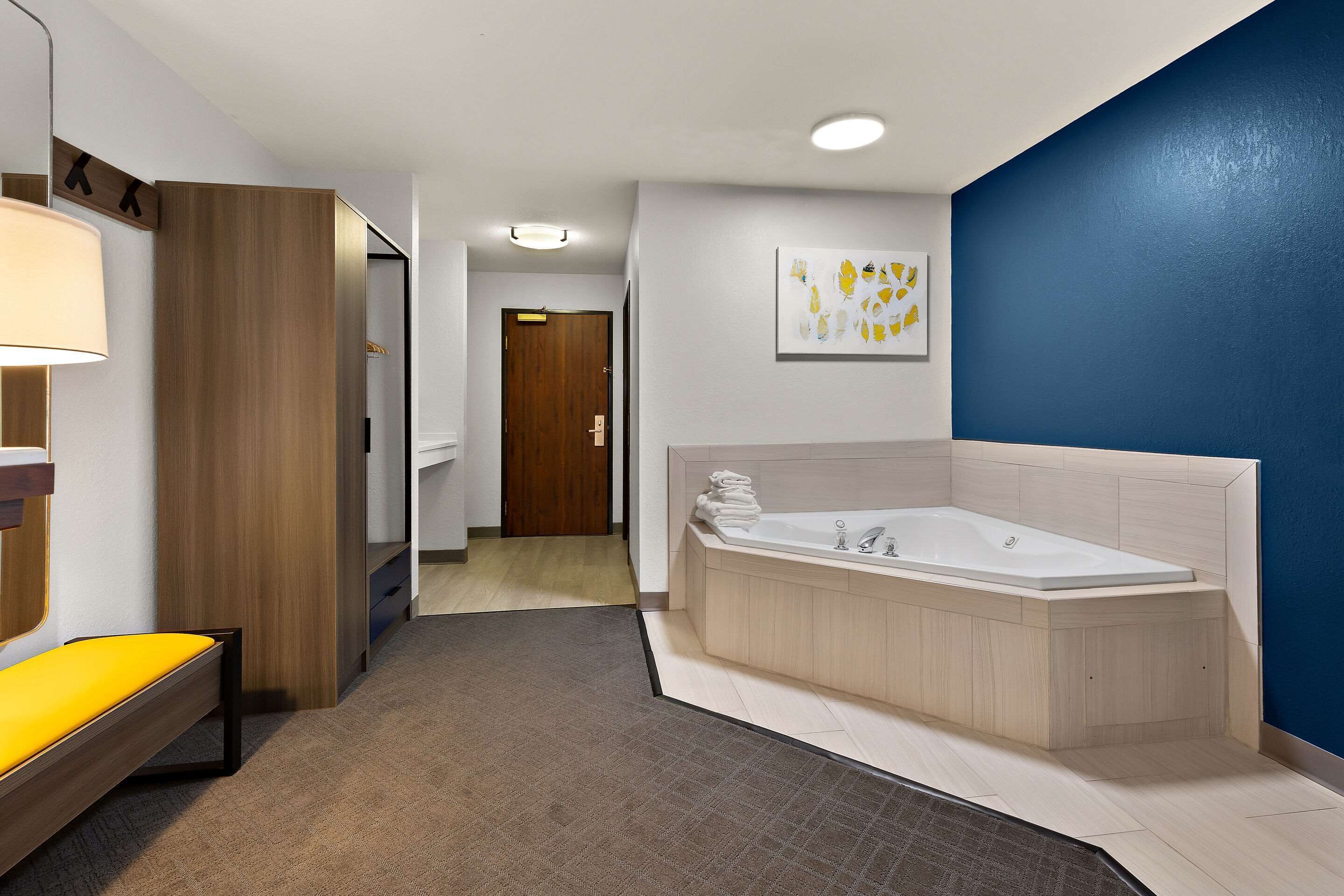 suite, 1 king bed, non smoking, hot tub | in-room safe, desk, laptop workspace, soundproofing