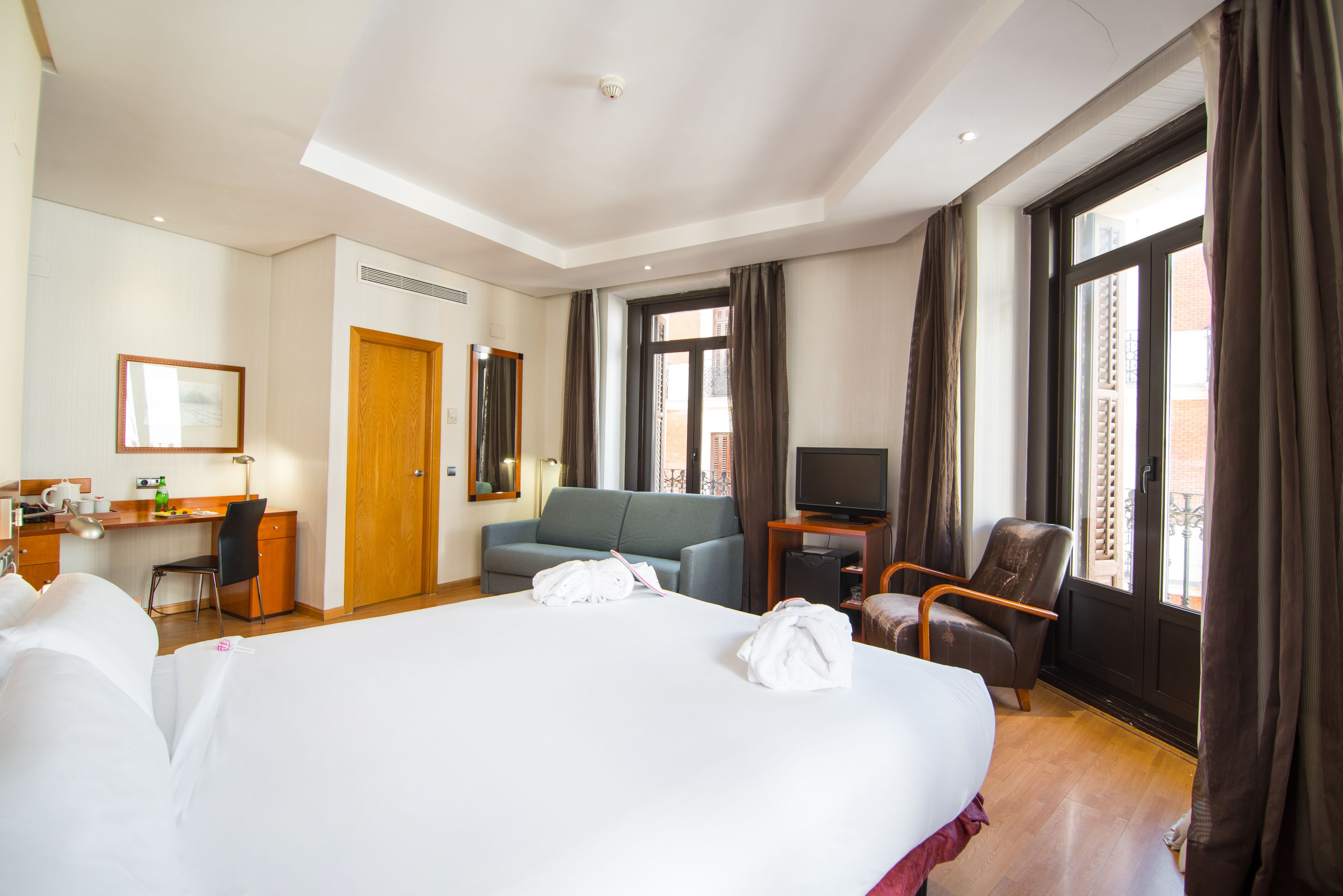 superior quadruple room, balcony | minibar, in-room safe, desk, blackout curtains