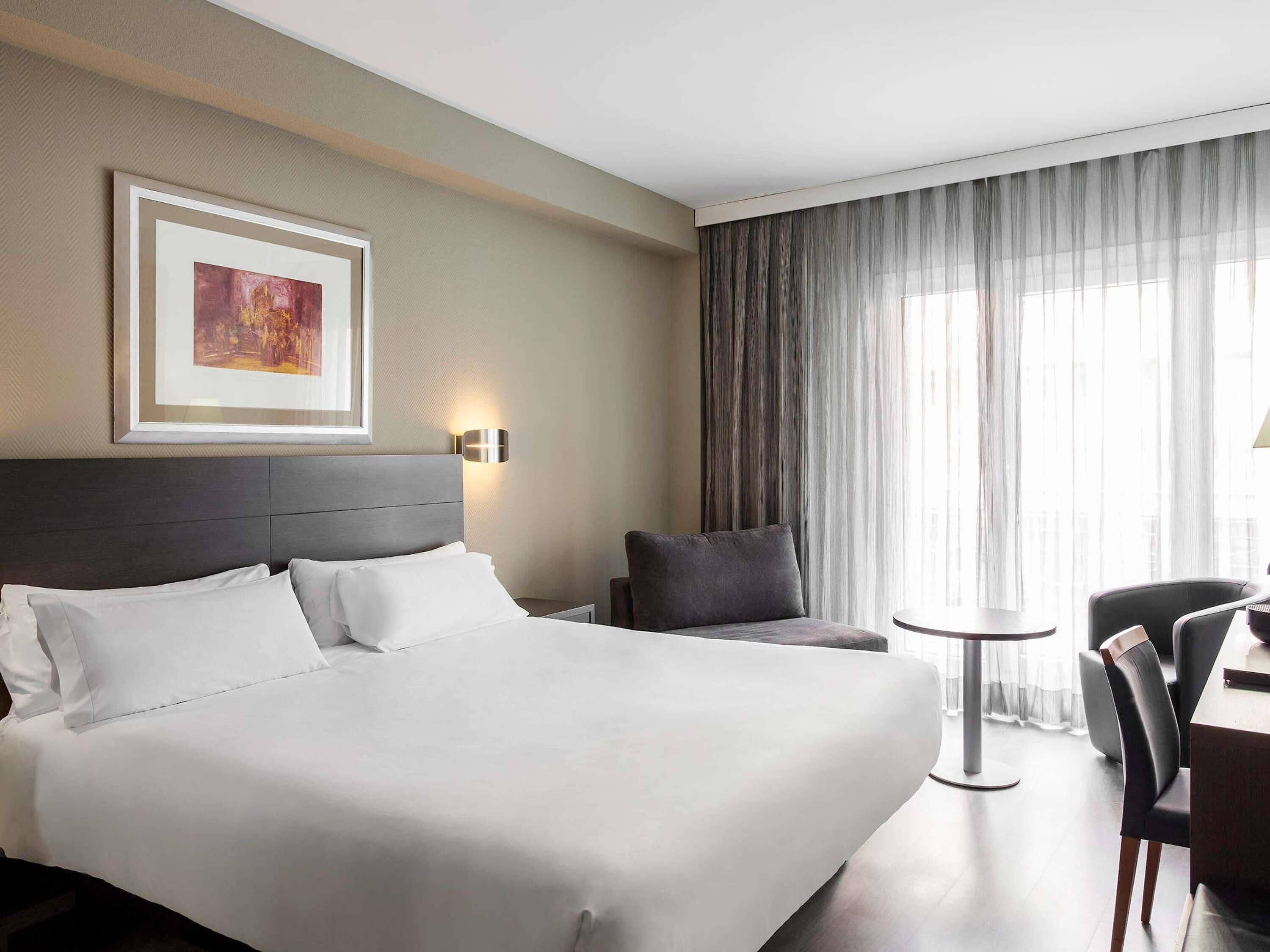 Premium bedding, down comforters, minibar, in-room safe