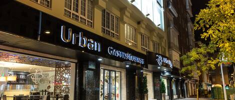 A building with a storefront named "Urban Gastronomy."