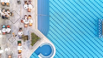 5 outdoor pools, open 10:00 AM to 5:00 PM, pool umbrellas, pool loungers