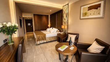 Deluxe Room, Partial Sea View | In-room safe, desk, laptop workspace, soundproofing