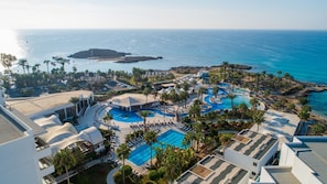 Indoor pool, pool umbrellas, pool loungers