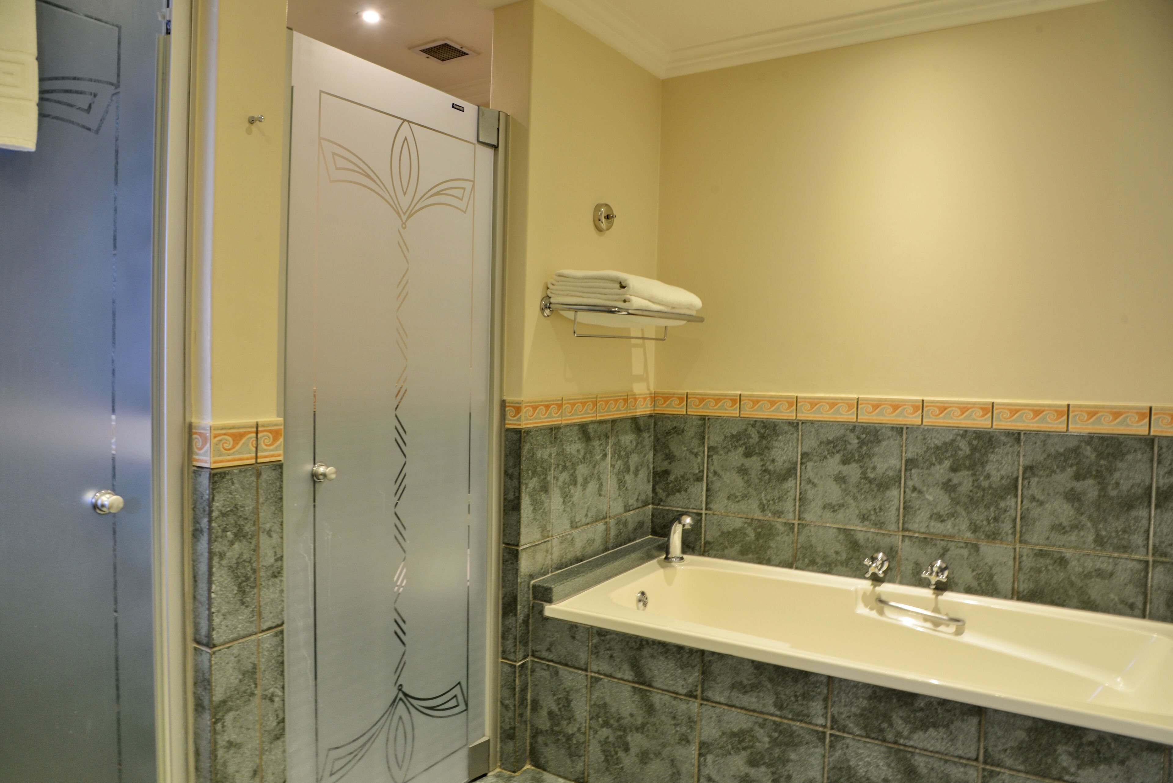 separate bathtub and shower, deep-soaking bathtub, free toiletries