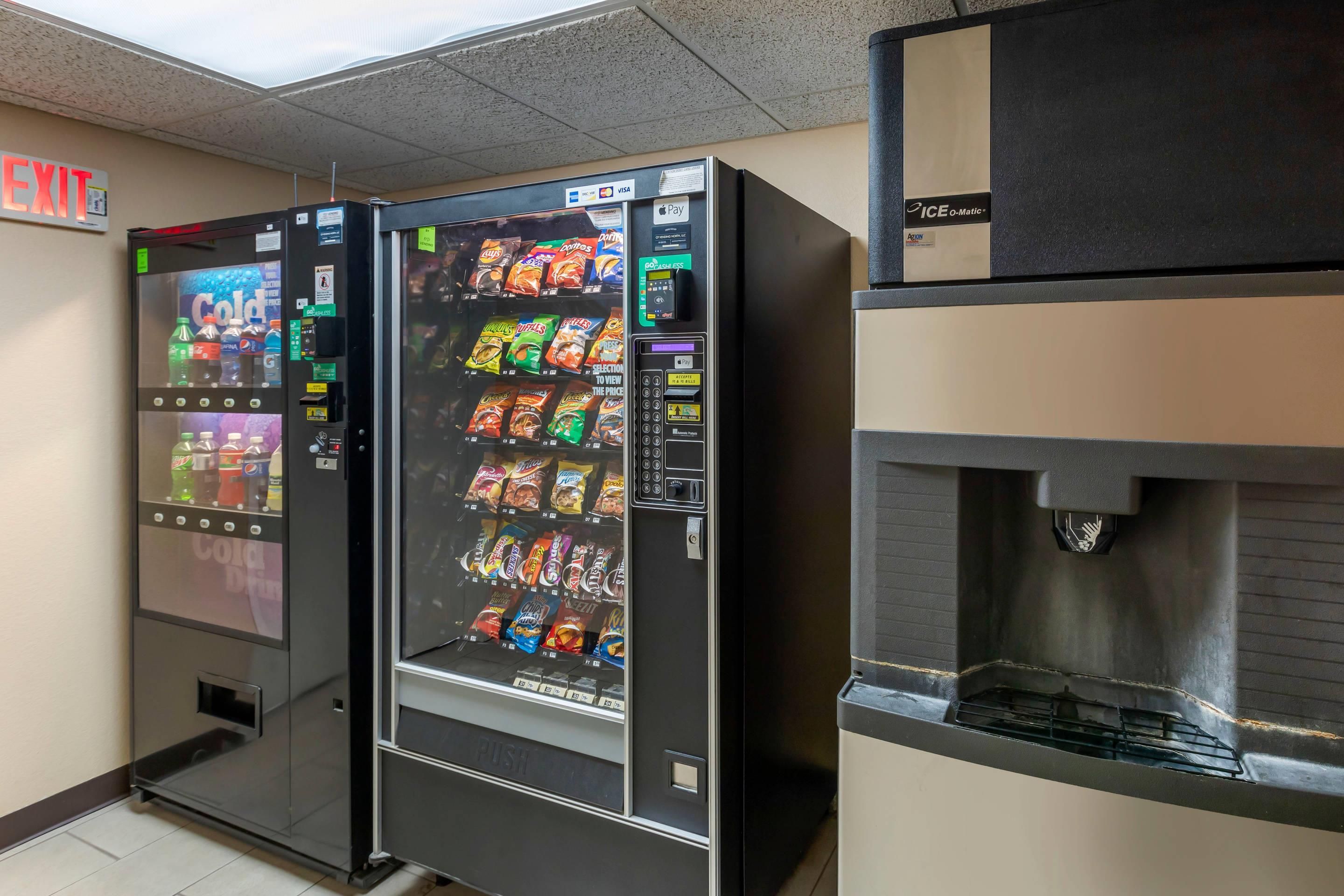 A vending machine with a variety of snacks and a water dispenser.