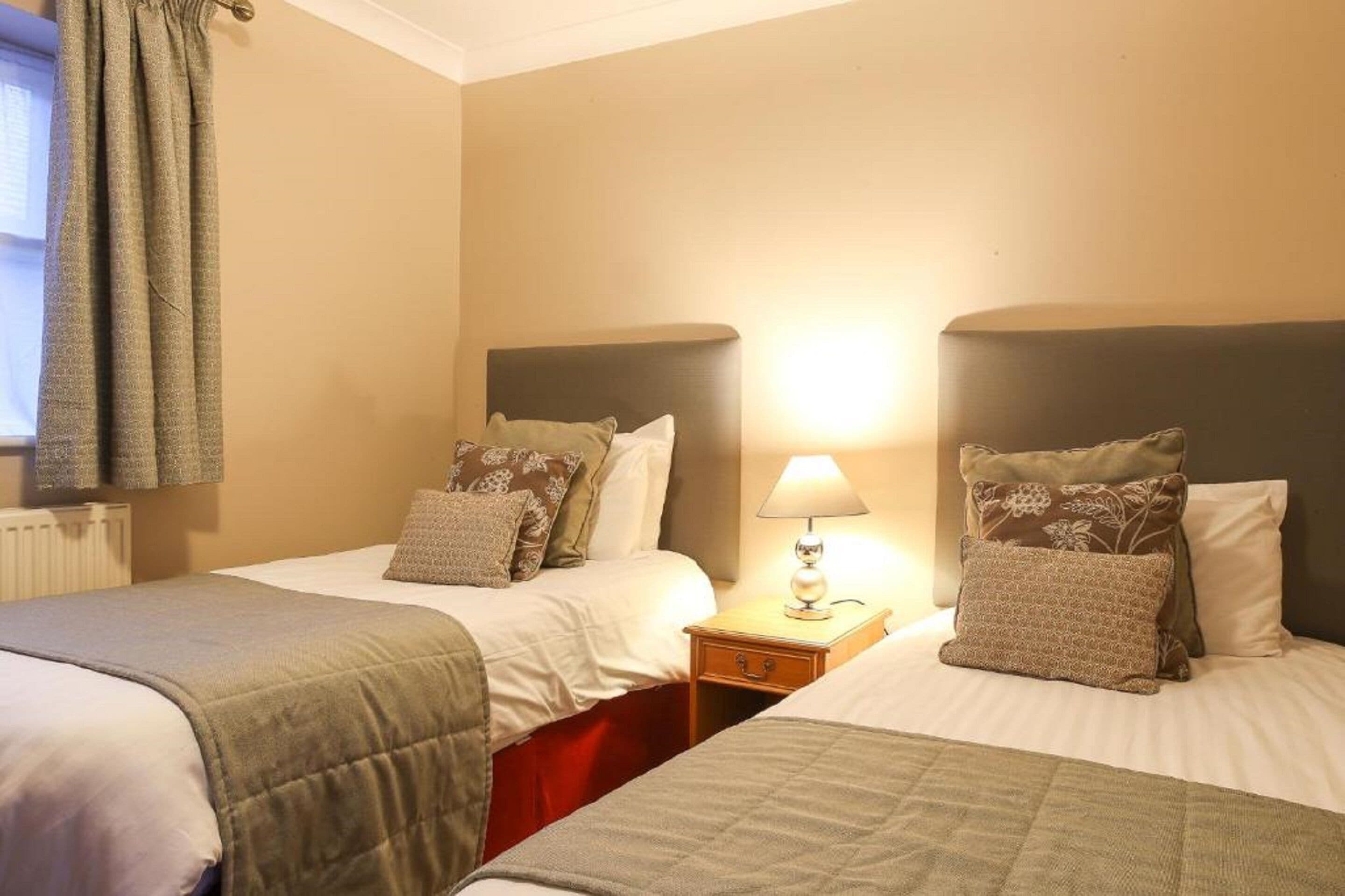 cosy courtyard twin room | in-room safe, iron/ironing board, free wifi, bed sheets