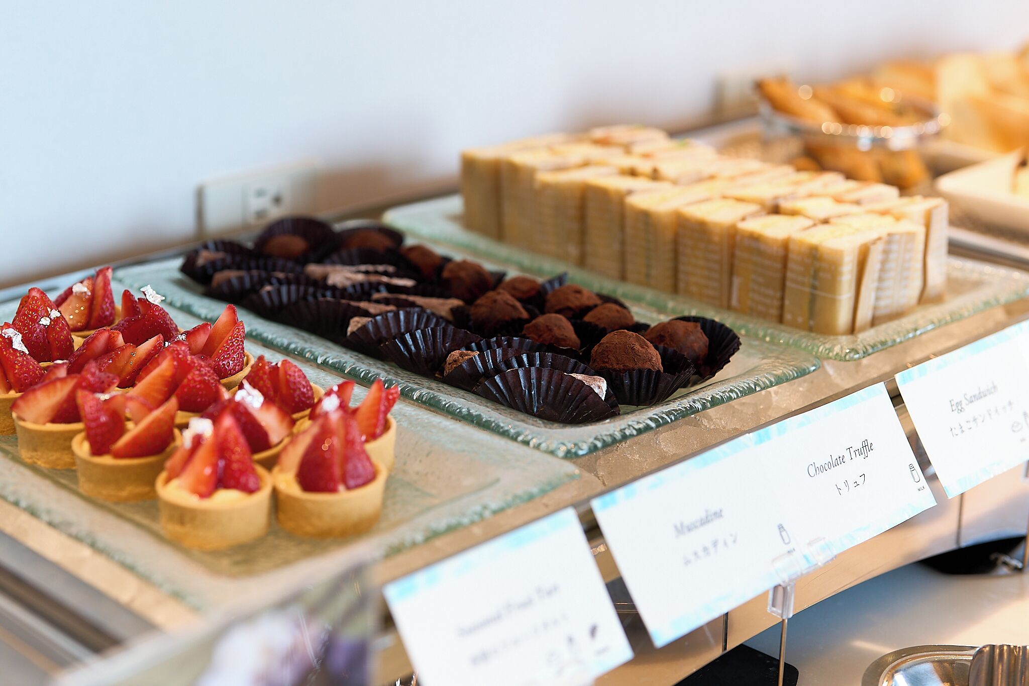 A dessert display with various sweet treats.
