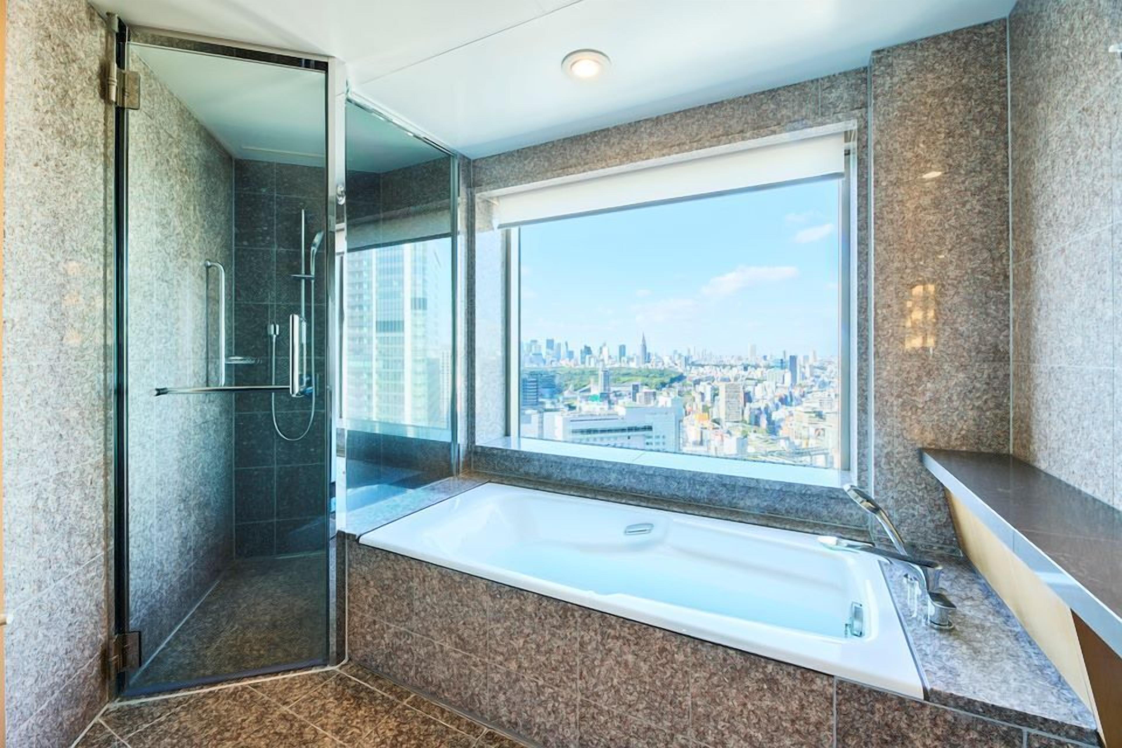 designer toiletries, hair dryer, bathrobes, slippers