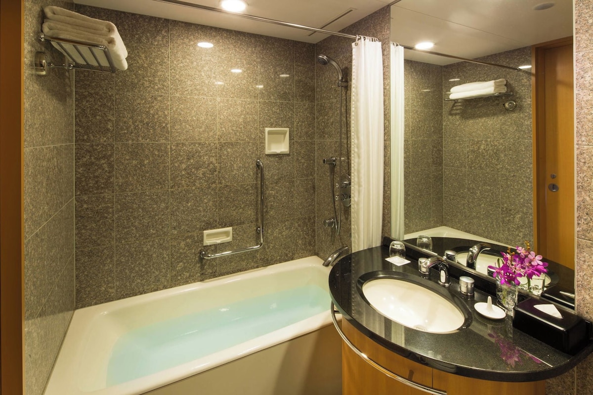 Bathroom | Designer toiletries, hair dryer, bathrobes, slippers