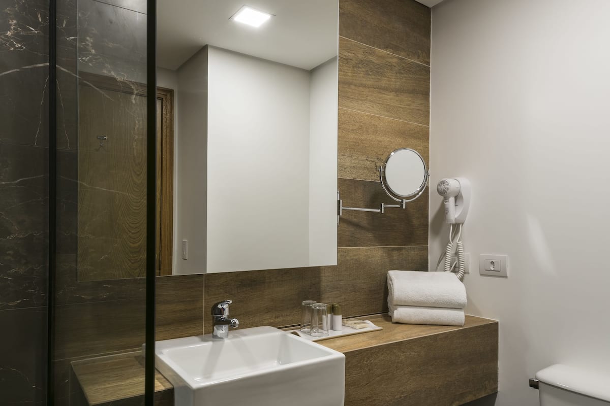 shower, eco-friendly toiletries, hair dryer, towels