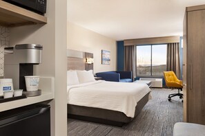 Suite, 1 King Bed | In-room safe, desk, iron/ironing board, cots/infant beds