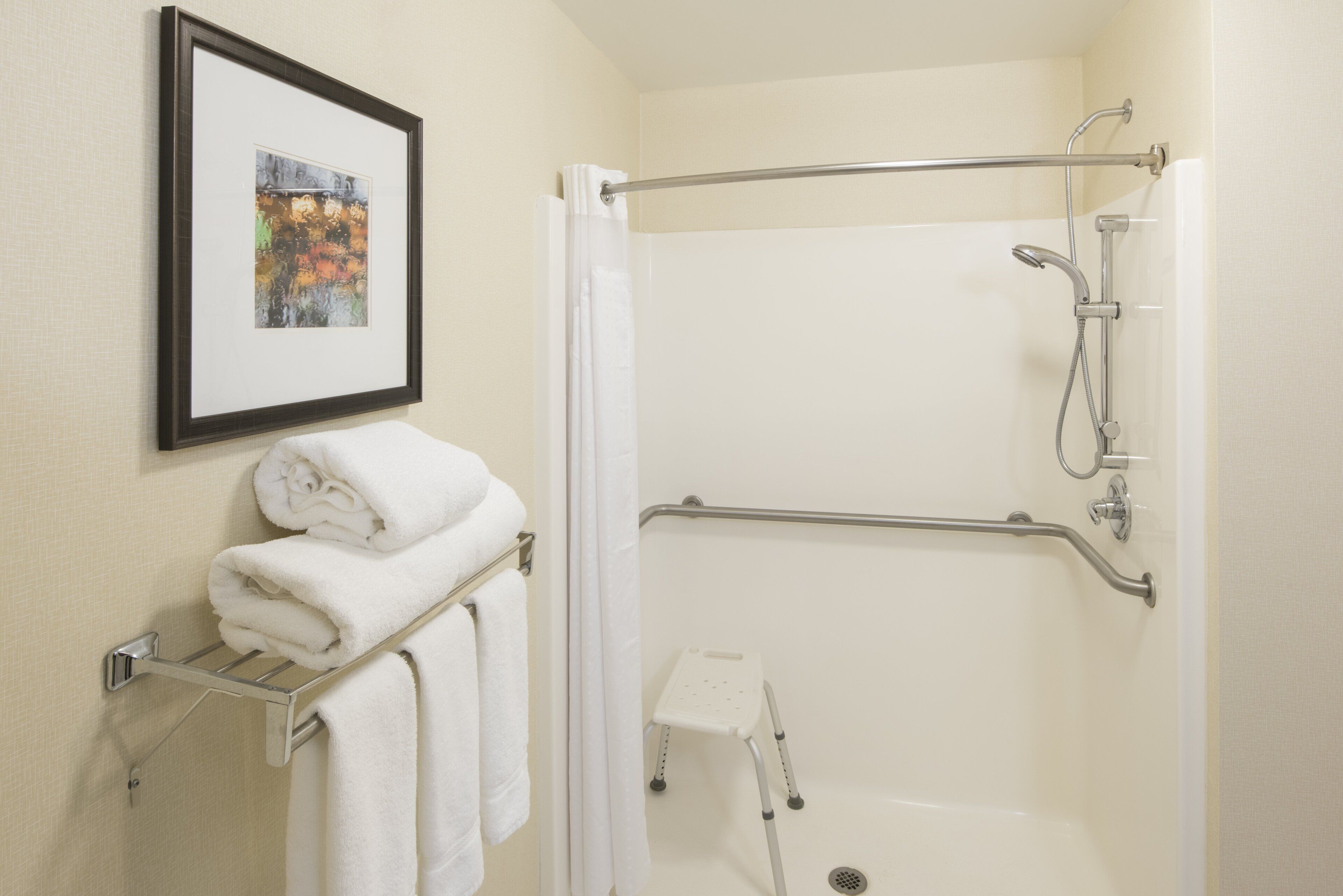 combined shower/bathtub, hair dryer, towels, soap