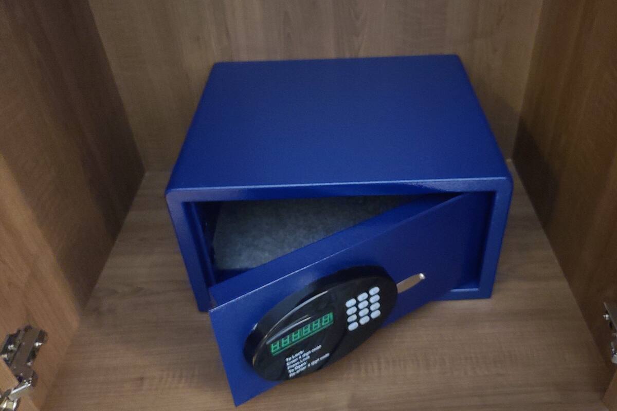 A blue safe with a digital keypad.