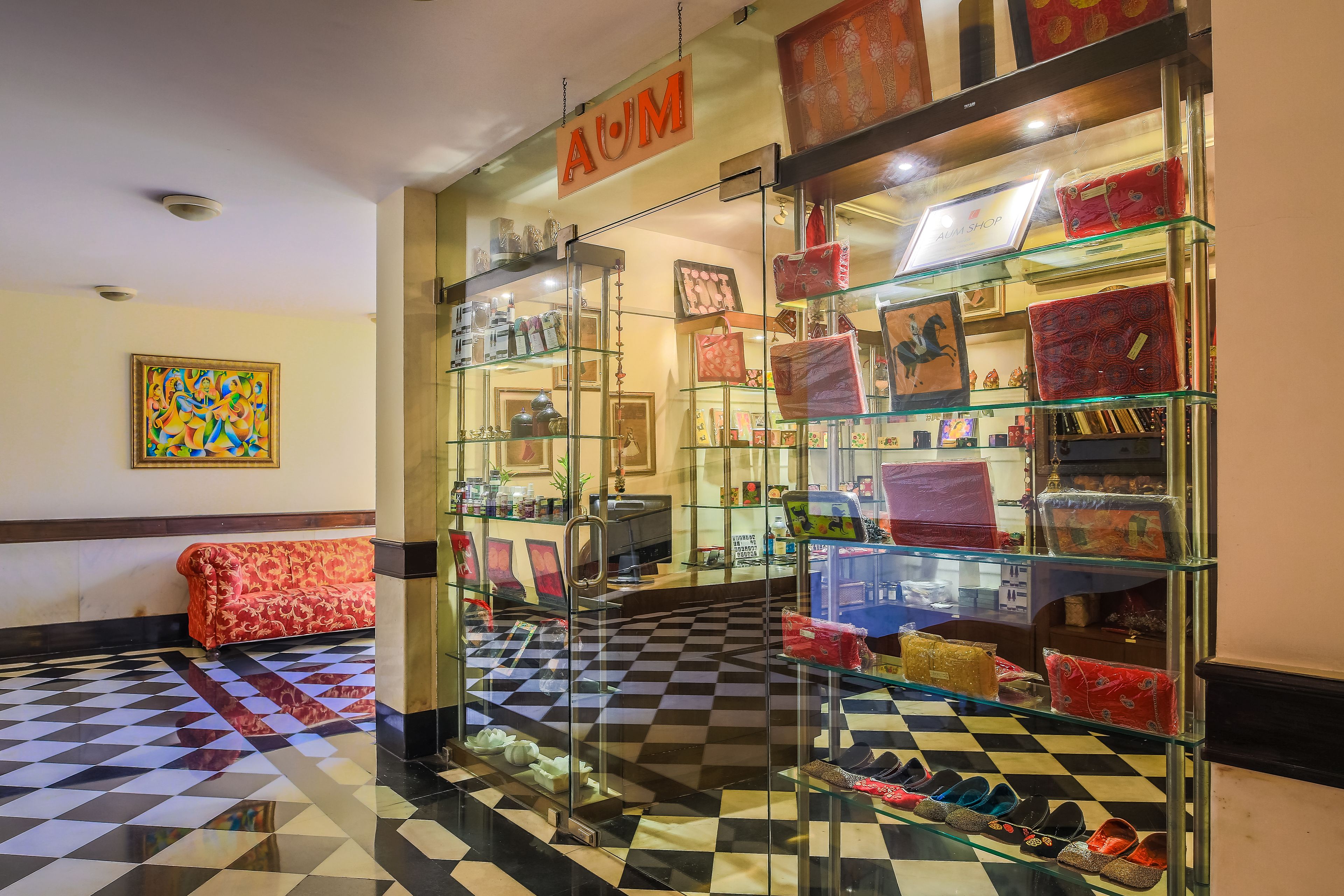 A boutique store with glass display cases and a checkered floor.