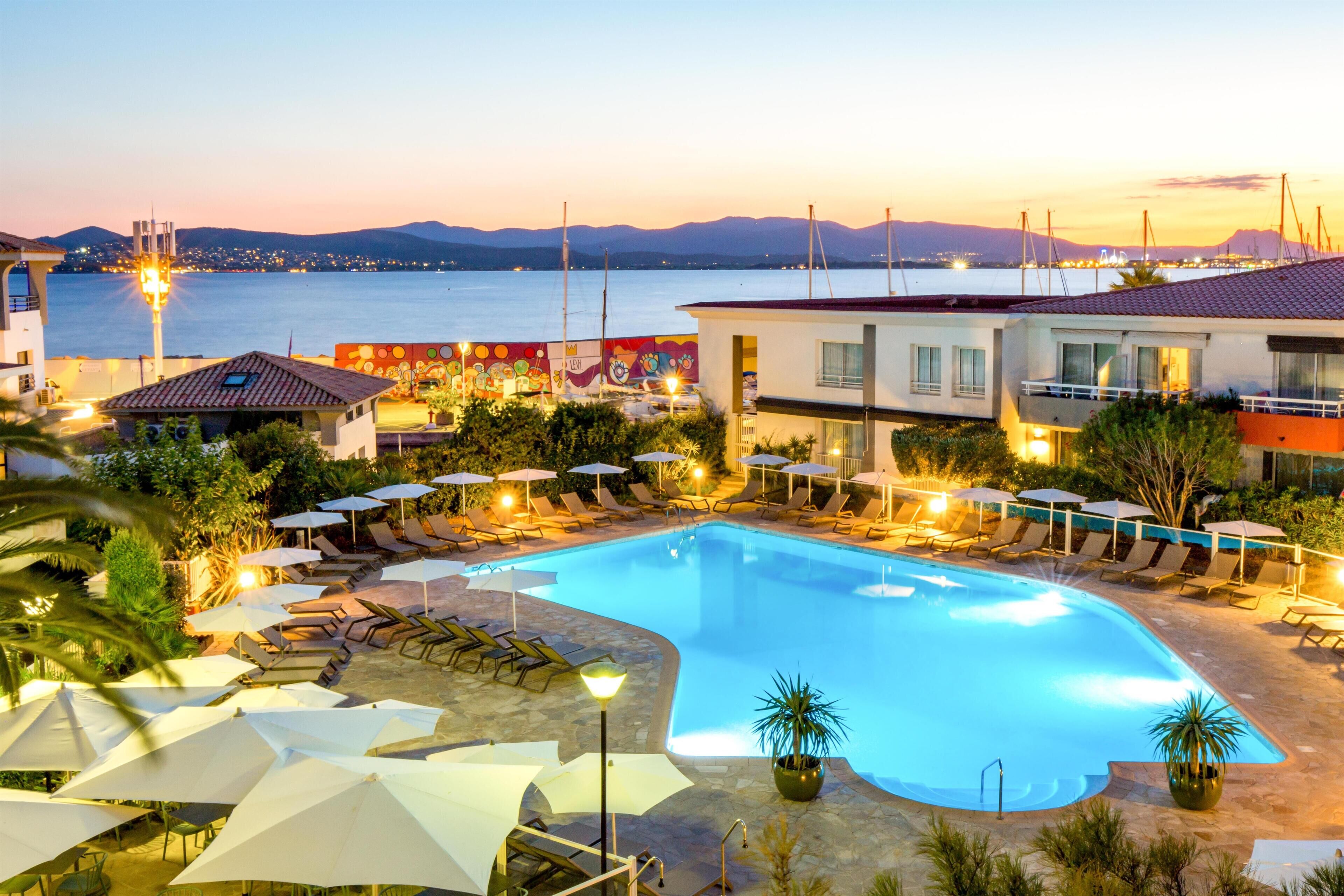 Outdoor pool, open 9:00 AM to 8:00 PM, pool loungers