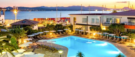 Outdoor pool, open 9:00 AM to 8:00 PM, pool loungers