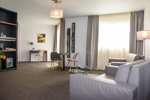 Suite, 1 Queen Bed, Non Smoking, Pool View | Premium bedding, minibar, in-room safe, individually decorated