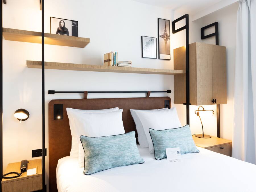 Luxe beddengoed, een minibar, een kluis op de kamer, een bureau