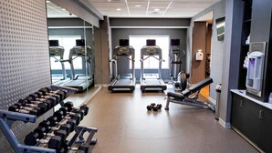 A gym with treadmills, dumbbells, and weight machines. - Fairfield Inn & Suites by Marriott Rockingham (Rockingham)