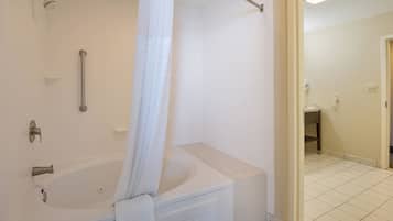 A bathroom with a bathtub, a shower, and a toilet.