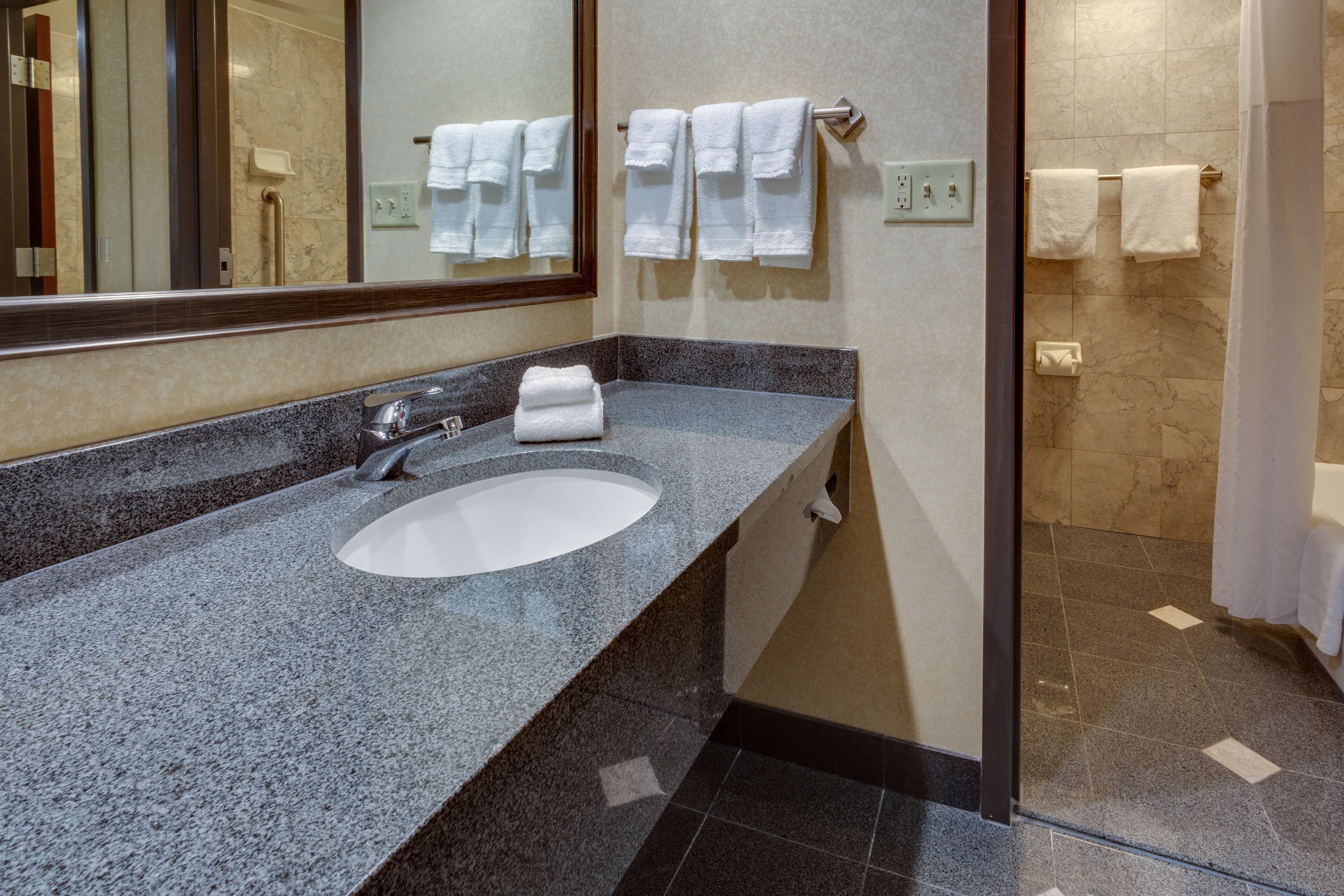 deluxe room, refrigerator & microwave | bathroom | combined shower/bathtub, free toiletries, hair dryer, towels