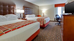 A hotel room with two beds, a television, a desk, and a chair. - Drury Inn & Suites Memphis Southaven (Horn Lake)