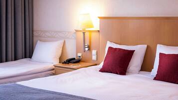 Standard Room (Family Three) | In-room safe, desk, laptop workspace, blackout drapes