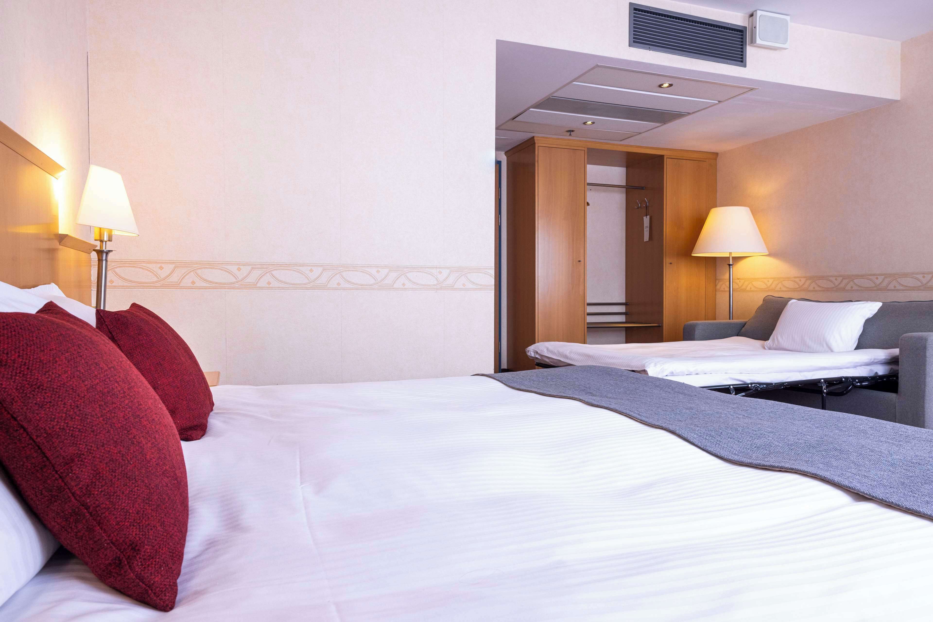 Standard Room (Family Four) | In-room safe, desk, laptop workspace, blackout drapes