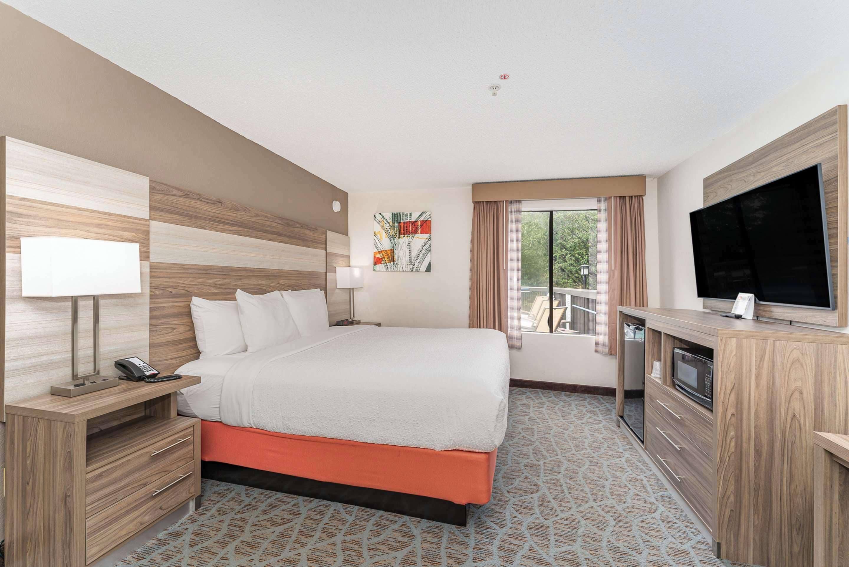 down duvets, pillow-top beds, desk, laptop workspace