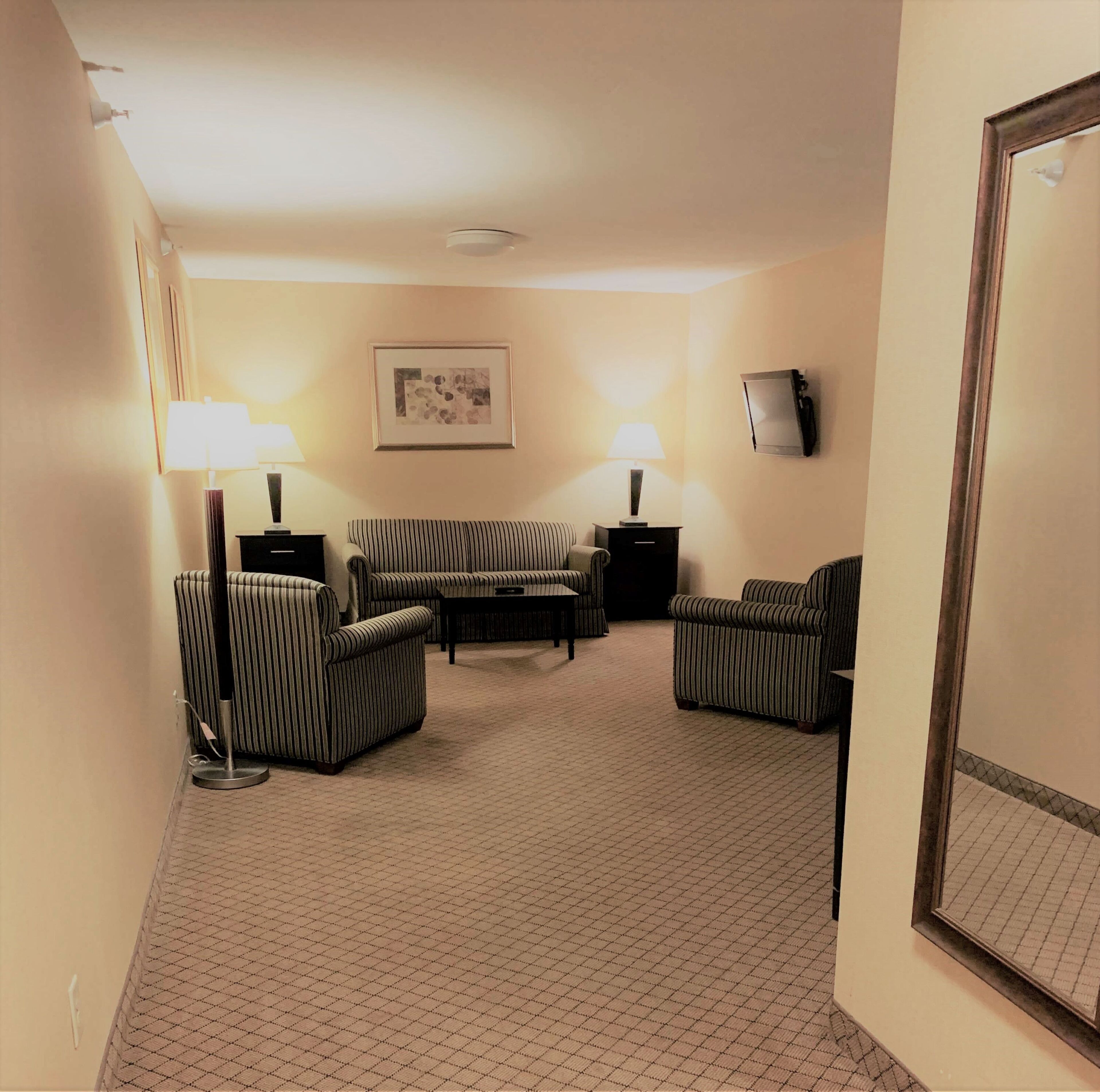 suite, 1 king bed | living area | tv
