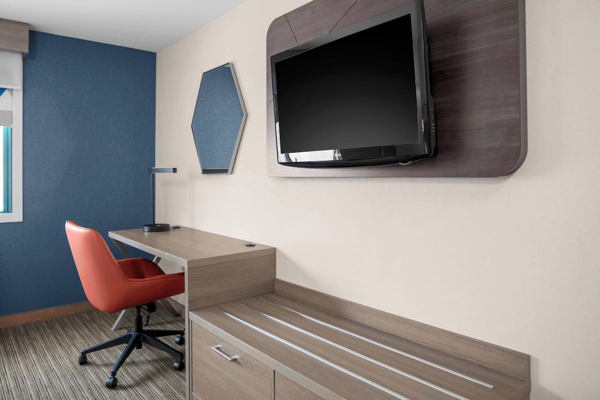 Premium bedding, desk, laptop workspace, blackout curtains
