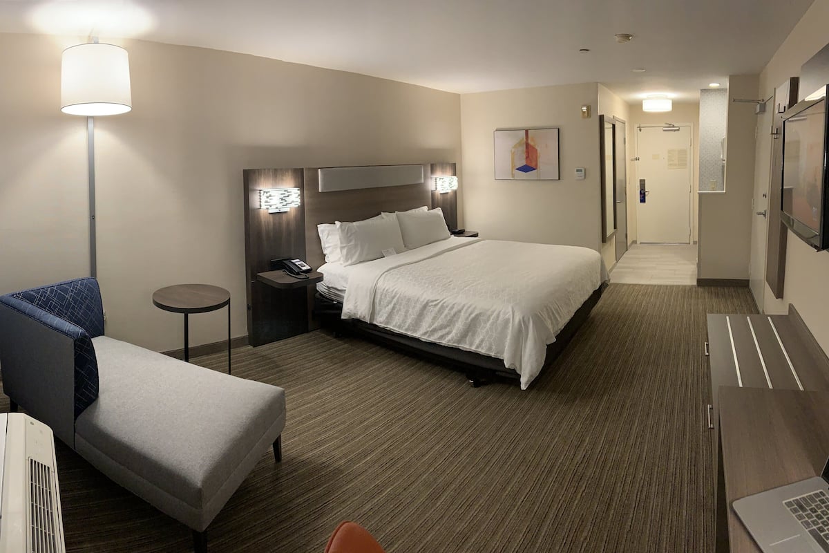 Premium bedding, desk, laptop workspace, blackout curtains