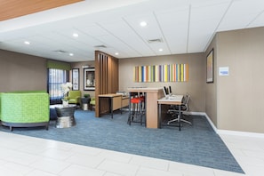 A modern office space with a reception area, a meeting room, and a desk area. - Holiday Inn Express Plymouth by IHG (Plymouth)